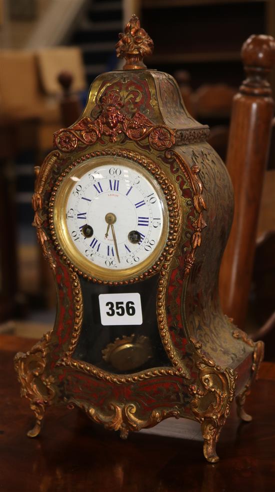 An early 20th century red boullework mantel clock, with enamelled dial signed Leroy à Paris 30cm